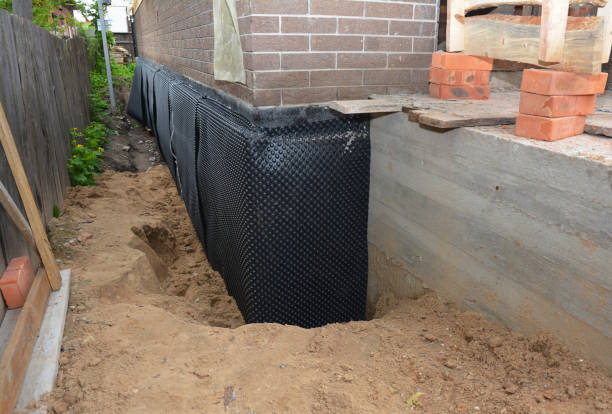 Happy homeowners after waterproofing job in Ghent
